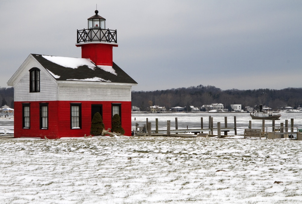 Getting out and enjoying beautiful views like this one of the kalamazoo lighthouse is one of our favorite things to do in kalamazoo in the winter