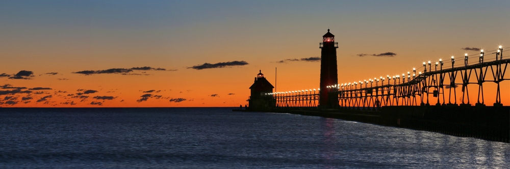Sunset at the south haven light, one of the most popular things to do in south haven, mi